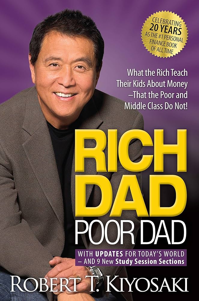 The image shows the book cover for "Rich Dad Poor Dad" by Robert T. Kiyosaki. The top half features a smiling photo of the author against a purple background. The title text is bold, with "Rich Dad" in large yellow letters and "Poor Dad" in smaller white letters below. A gold badge on the upper right highlights the book’s 20-year anniversary as the #1 personal finance book. The subtitle reads: "What the Rich Teach Their Kids About Money – That the Poor and Middle Class Do Not!" At the bottom, the author’s name is displayed in white capital letters.